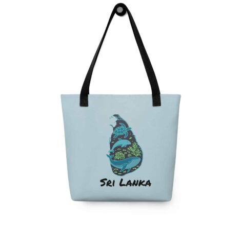 Woman carrying the stylish deep blue Sri Lanka Tote Bag over her shoulder on a sunny day.